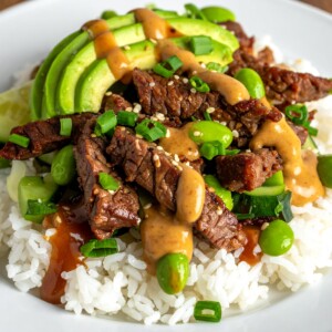 Sautéed, juicy Beef Strips, avocado, cucumber, edamame, and chopped green onion